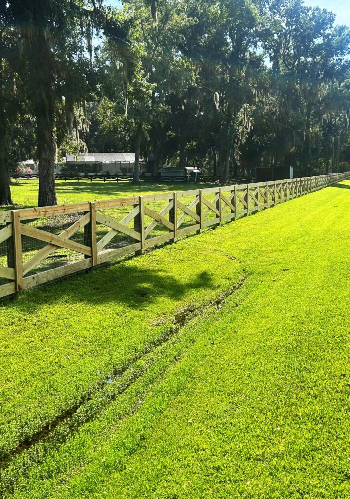 Long ranch rail farm fence line installed on rural property in Marion County Florida