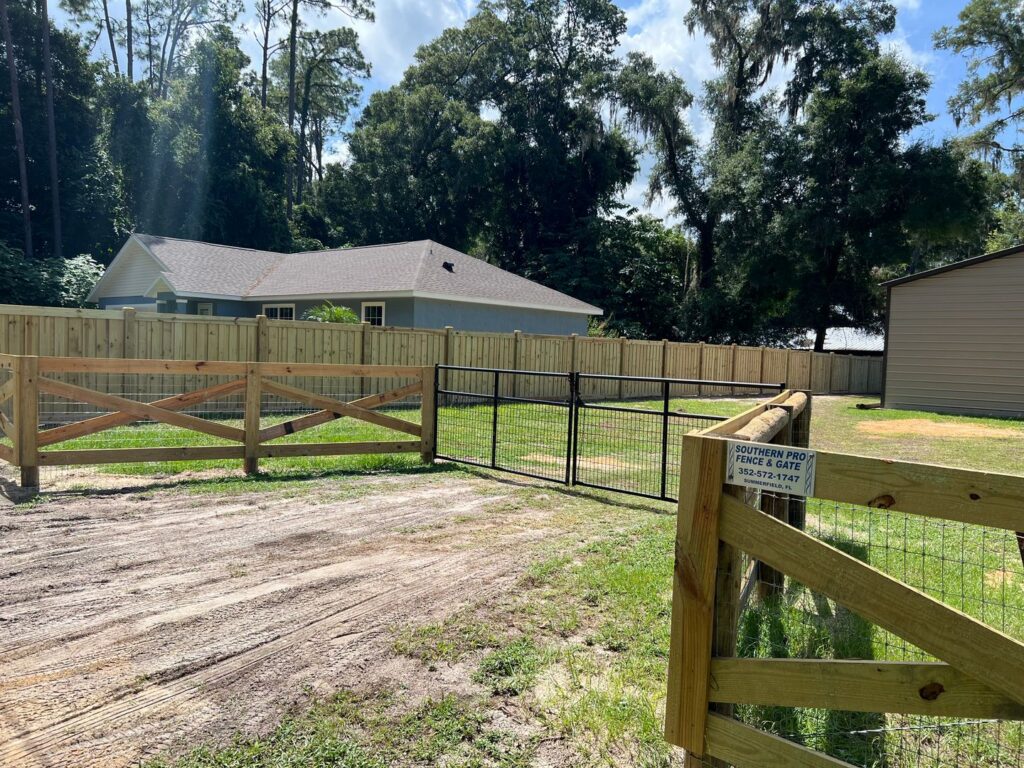 Long run of wood privacy fence installed along a residential property line in North Central Florida